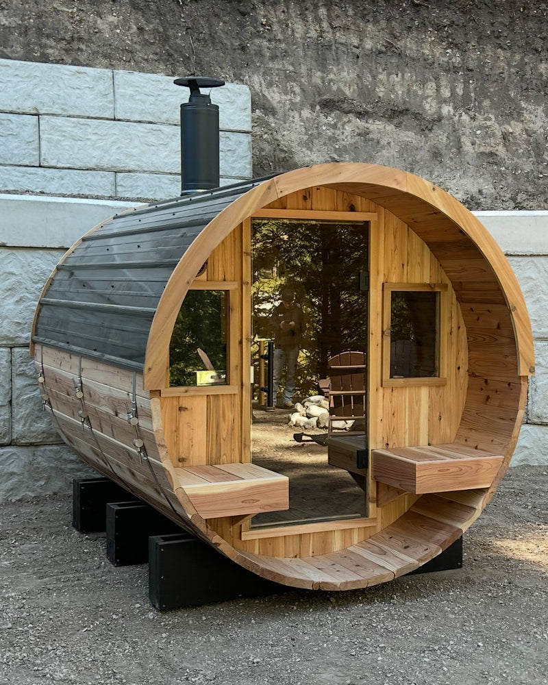 XL Blazin Barrel sauna with a covered porch and chimney at a customer home in Downey, Idaho
