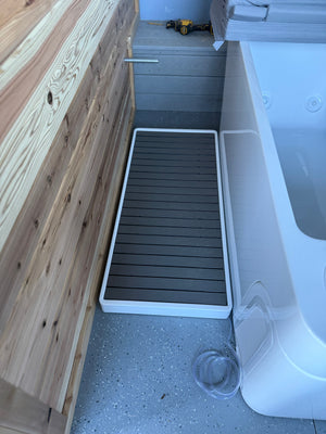 Side view of the cold plunge tub with its step platform