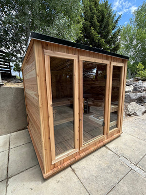 Blazin Timberline Sugi cedar outdoor sauna fully assembled on a backyard patio