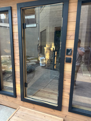 Close view of the Timberline Lux glass door, black frame and handle