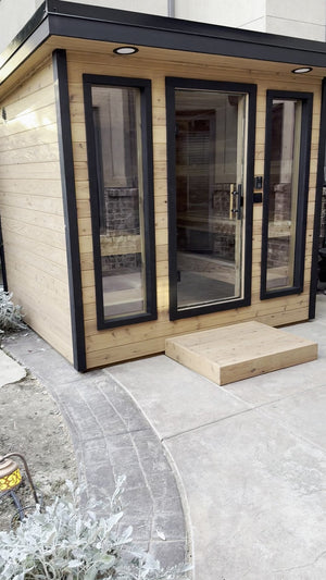 Timberline Lux glass front and cedar step against a house wall