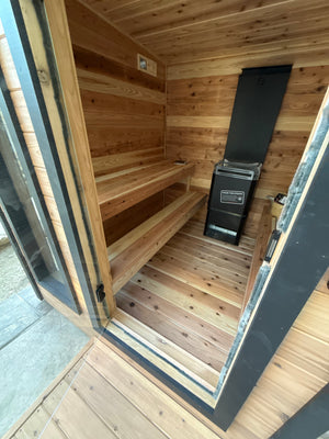Timberline Lux interior through the open glass door, with cedar benches and heater