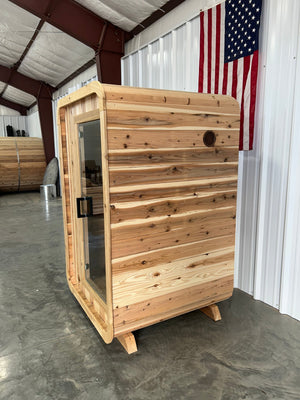 Blazin Pod Mini one-person cedar sauna, full side view on its base