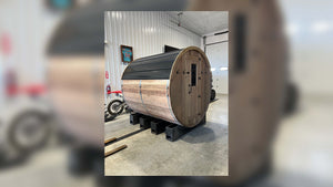 XL Blazin Barrel Sauna (6 to 8 person), cedar barrel on support blocks inside the shop